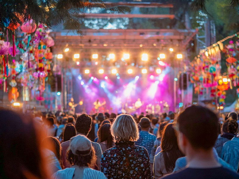 A sea of festival-goers gathered together, immersed in the music and atmosphere of the event