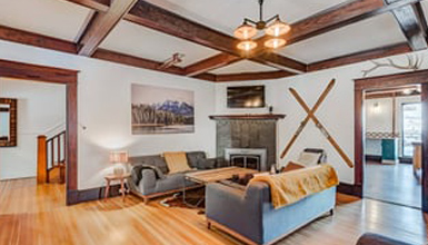 A living room with couches and a fireplace