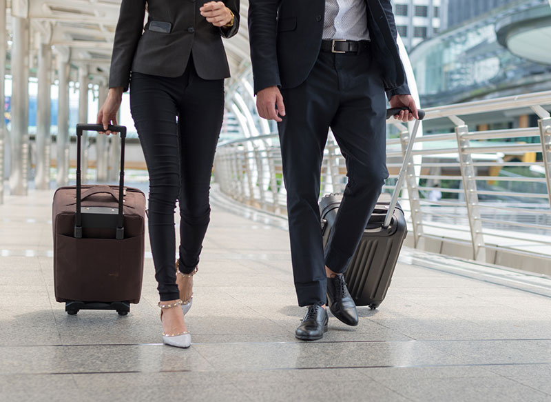 corporate people walking with luggage