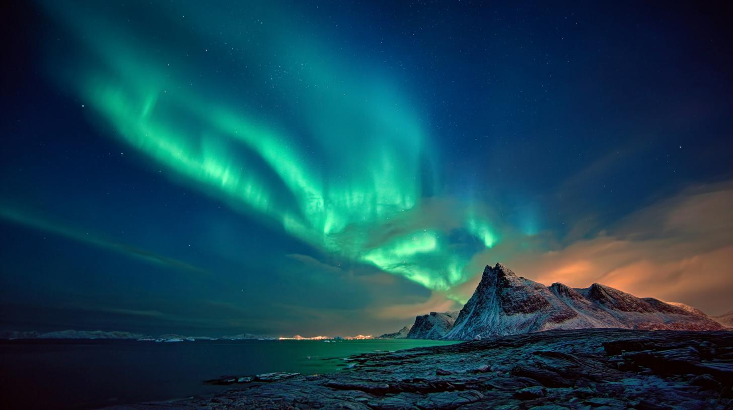 Aerial view of Greenland's dramatic coastline and ice formations, capturing untouched natural beauty ideal for adventure seekers. travelnerd-httpssmjrunbjv7jvjewhw-greenland-aurora---ar-169-104be719-57db-4d30-ad3c-8c700f98ab99-0