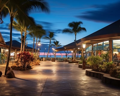 Nighttime view of resort entrance with lit walkway.