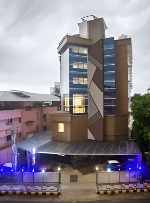 a tall building with a tower in the middle of it