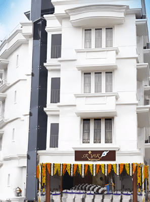 a man and woman standing in front of a building