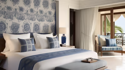 a bedroom suited for two with a large bed and a couch a bedroom suited for two with a large bed and a couch