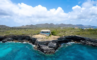 a luxury villa on a cliff overlooking the ocean