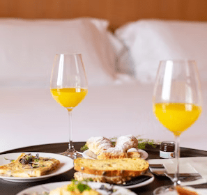 bread with sliced lemon on white ceramic plate