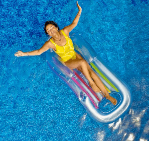 woman riding on plastic floating buoy on body of water