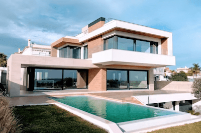 White and brown concrete building under blue sky during daytime
