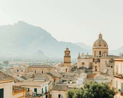 a view of a city with a mountain in the background