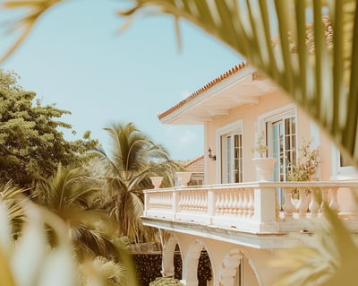 a balcony with palm trees