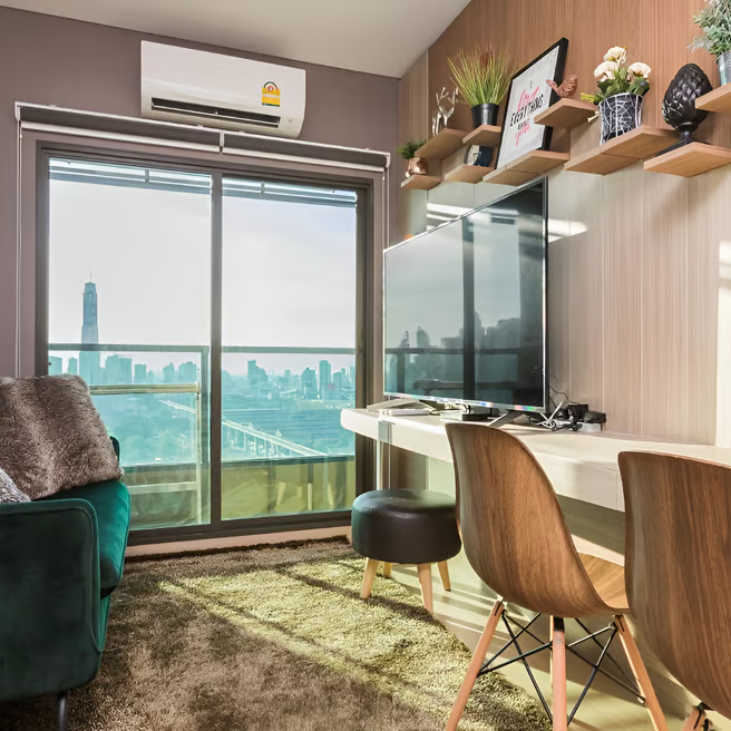 a cozy suite with a couch and chairs a cozy suite with a couch and chairs