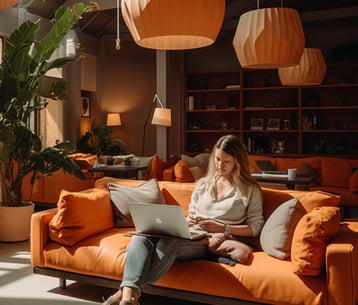 solo female travelers on their laptops in the communal space of a hostel in Cancun, Mexico