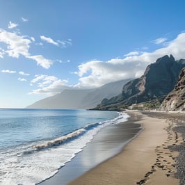 A sandy beach with footprints leading into the distance.