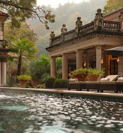 a pool with a fountain and lounge chairs in Geres