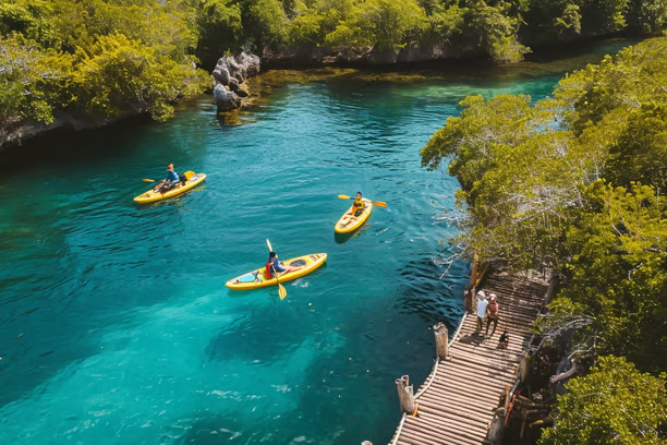a group of people kayaking down a river a group of people kayaking down a river