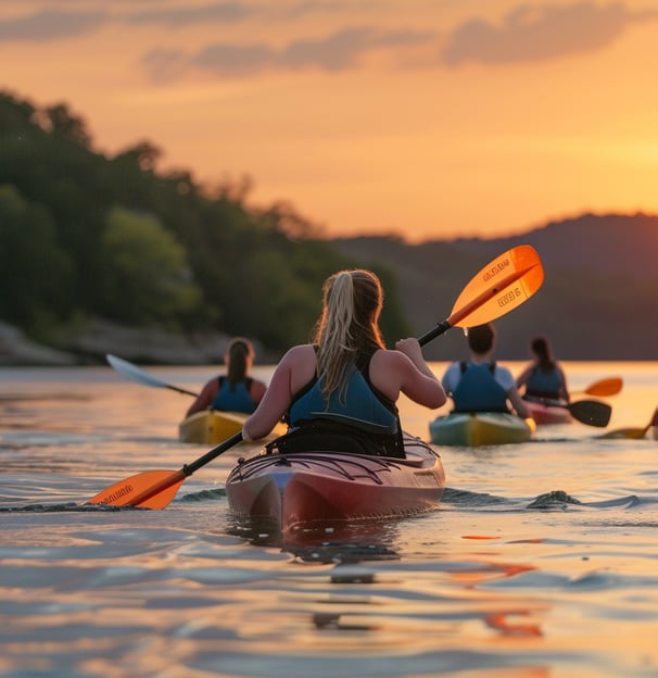 Kayakers enjoying a tranquil sunset on Table Rock Lake, surrounded by the stunning natural beauty. Kayakers enjoying a tranquil sunset on Table Rock Lake, surrounded by the stunning natural beauty.