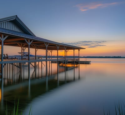 Tranquil lakeside marina with covered boat docks, reflecting the serenity of outdoor water activitie