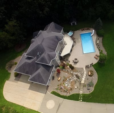 a house with a pool in the middle of a lush greenery in Madison, Wisconsin