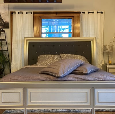 a bedroom with a bed and a lamp in Madison, Wisconsin