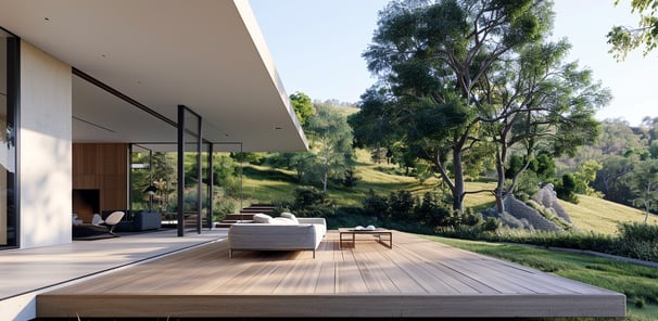 Modern outdoor entertaining area with open plan design overlooking a verdant hillside.