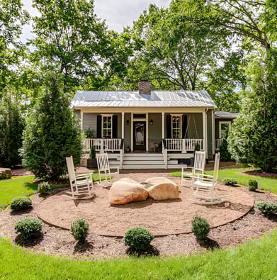 A luxury farmhouse with beautiful sitting area in the front