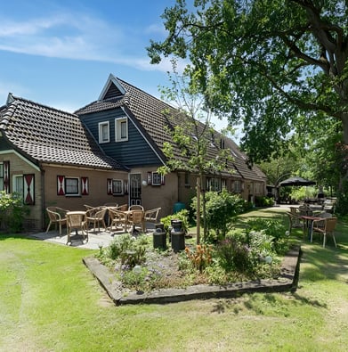 A house with a large lawn and a garden in Netherlands