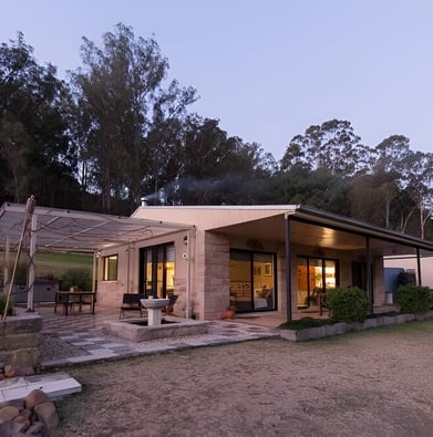 A house with a large patio and a fire pit in Laguna, New South Wales