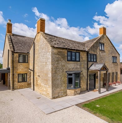 A large house with a lawn in Broadway, England