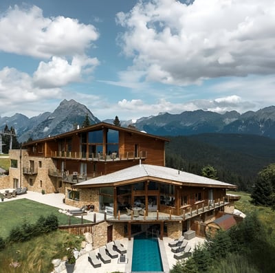 A house with a pool in the mountains in innsbruck, austria