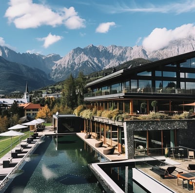A resort with a large pool with a view of mountains in innsbruck, austria