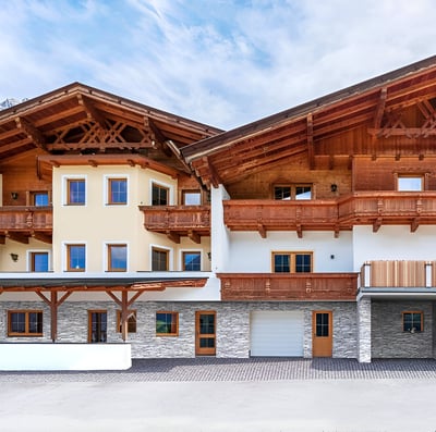 A large wooden building with a balcony in innsbruck, austria