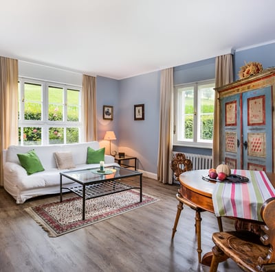a living room with a couch and a table in innsbruck, austria