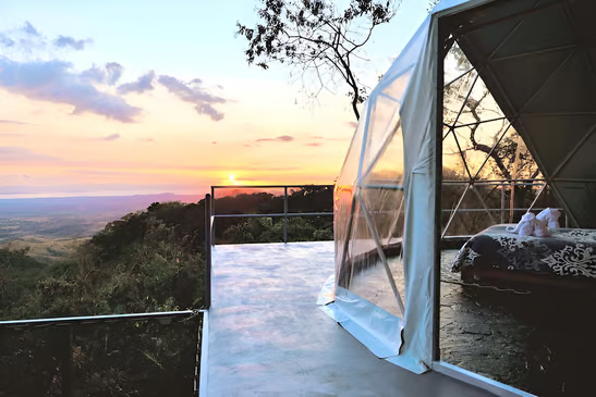 A glamping room with a view of the sunset in costa rica A glamping room with a view of the sunset in costa rica