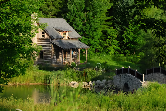 A log cabin with a stone bridge over a stream in Ontario, Canada A log cabin with a stone bridge over a stream in Ontario, Canada