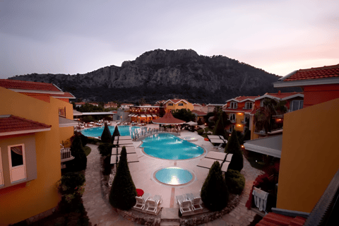 a pool with a mountain in the background in marmaris, turkey a pool with a mountain in the background in marmaris, turkey