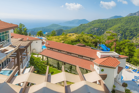a view of a resort with a pool and a view of the ocean in marmaris, turkey a view of a resort with a pool and a view of the ocean in marmaris, turkey