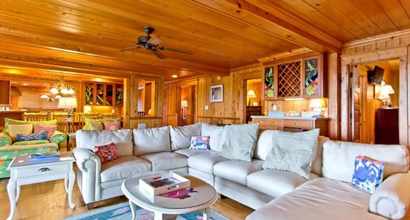 A cozy living room in a wooden villa