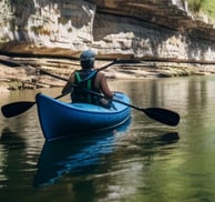 Kayakers glide through serene waters in an Arkansas State Park