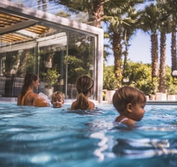 Family enjoys a sunny pool day at a luxury Arkansas hotel
