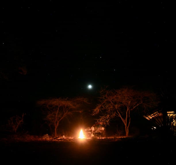 a camper is lit up at night