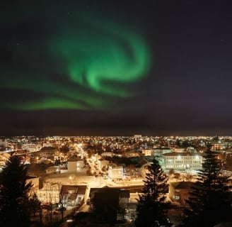 . Northern lights illuminate city skyline at night