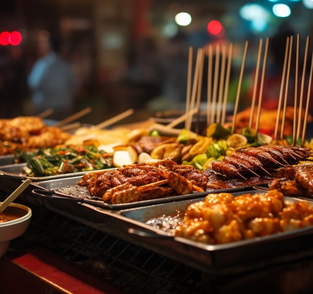 a variety of street foods on display at a night market