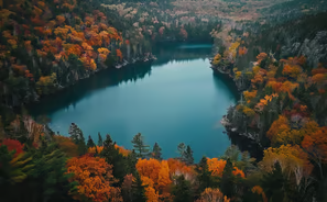 Serene lake encircled by autumn's fiery palette, a secluded haven. Serene lake encircled by autumn's fiery palette, a secluded haven.