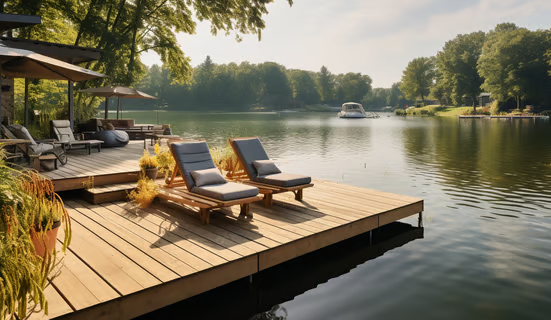 Loungers on the lakefront dock of a luxury family lake retreat Loungers on the lakefront dock of a luxury family lake retreat