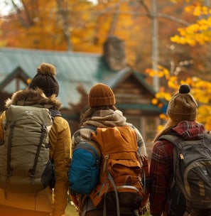 Friends set out on an autumn hike through golden woods.