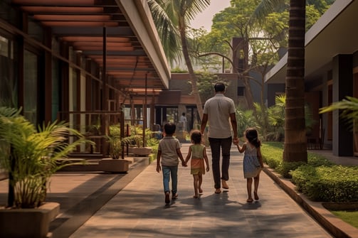 a family walking in the outdoor area of their hotel in Nagpur, India
