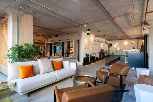A hotel lobby decorated with colorful furnitures