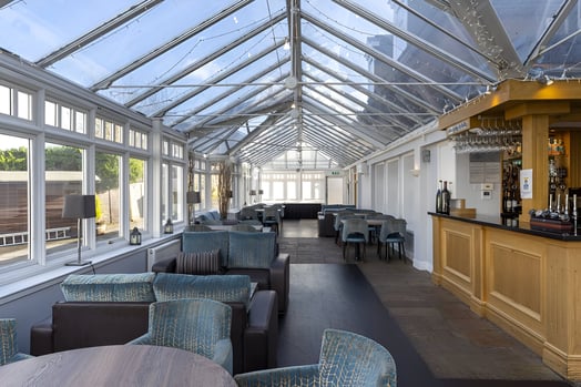 a restaurant with a bar and chairs in southside glasgow