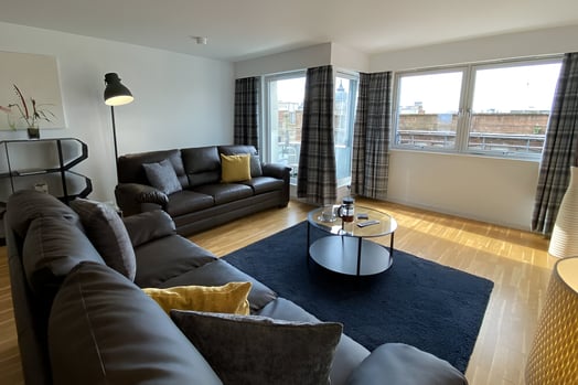 a living room with a couch and a coffee table in north glasgow