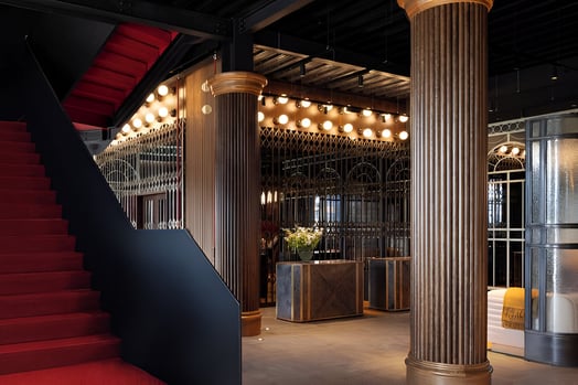 a staircase leading to a reception area of a hotel in glasgow city centre